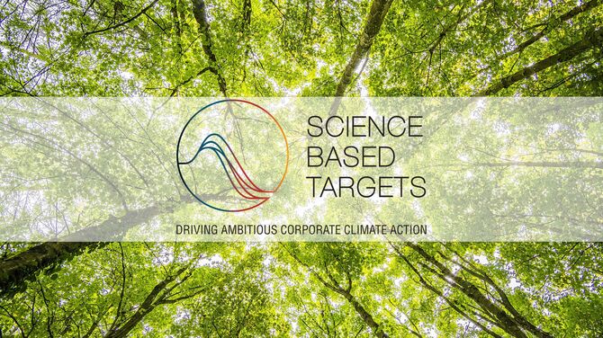 The Science Based Targets initiative logo in front of green tree tops.
