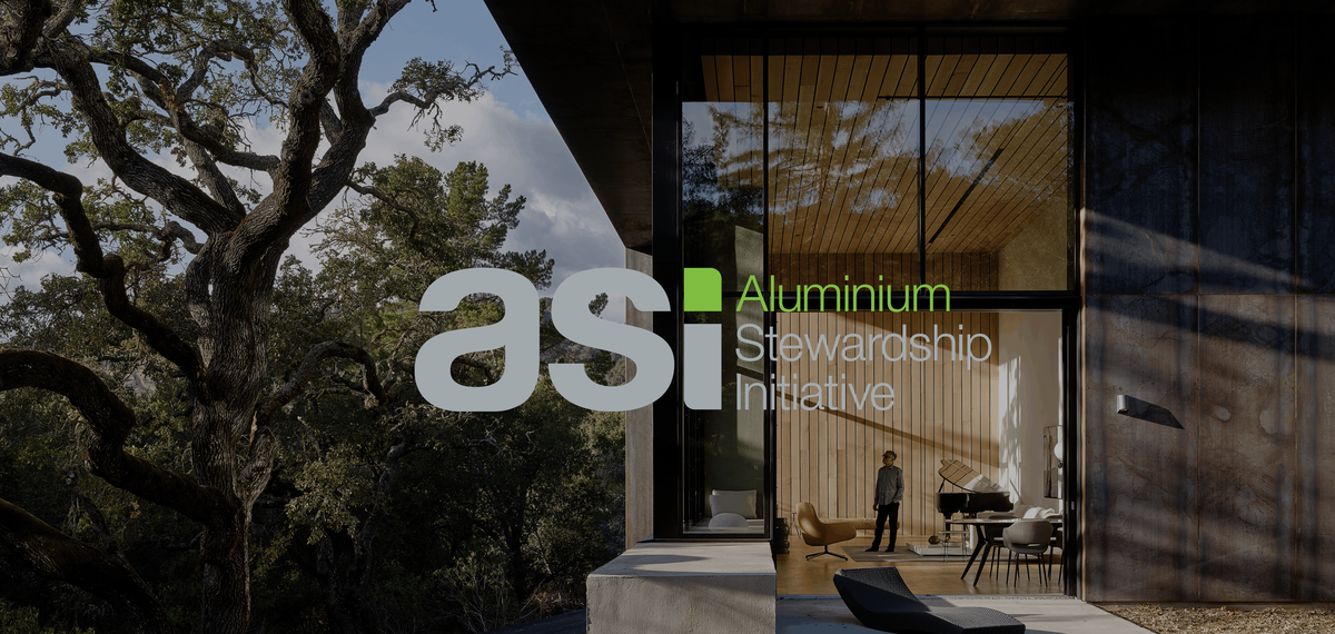 ASI logo in front of modern villa in a forest.